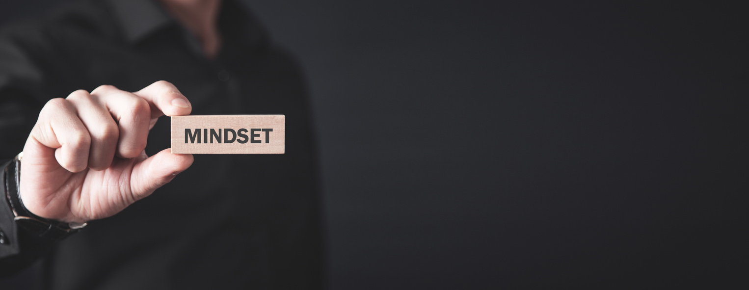 Man holding wooden block. Mindset. Business